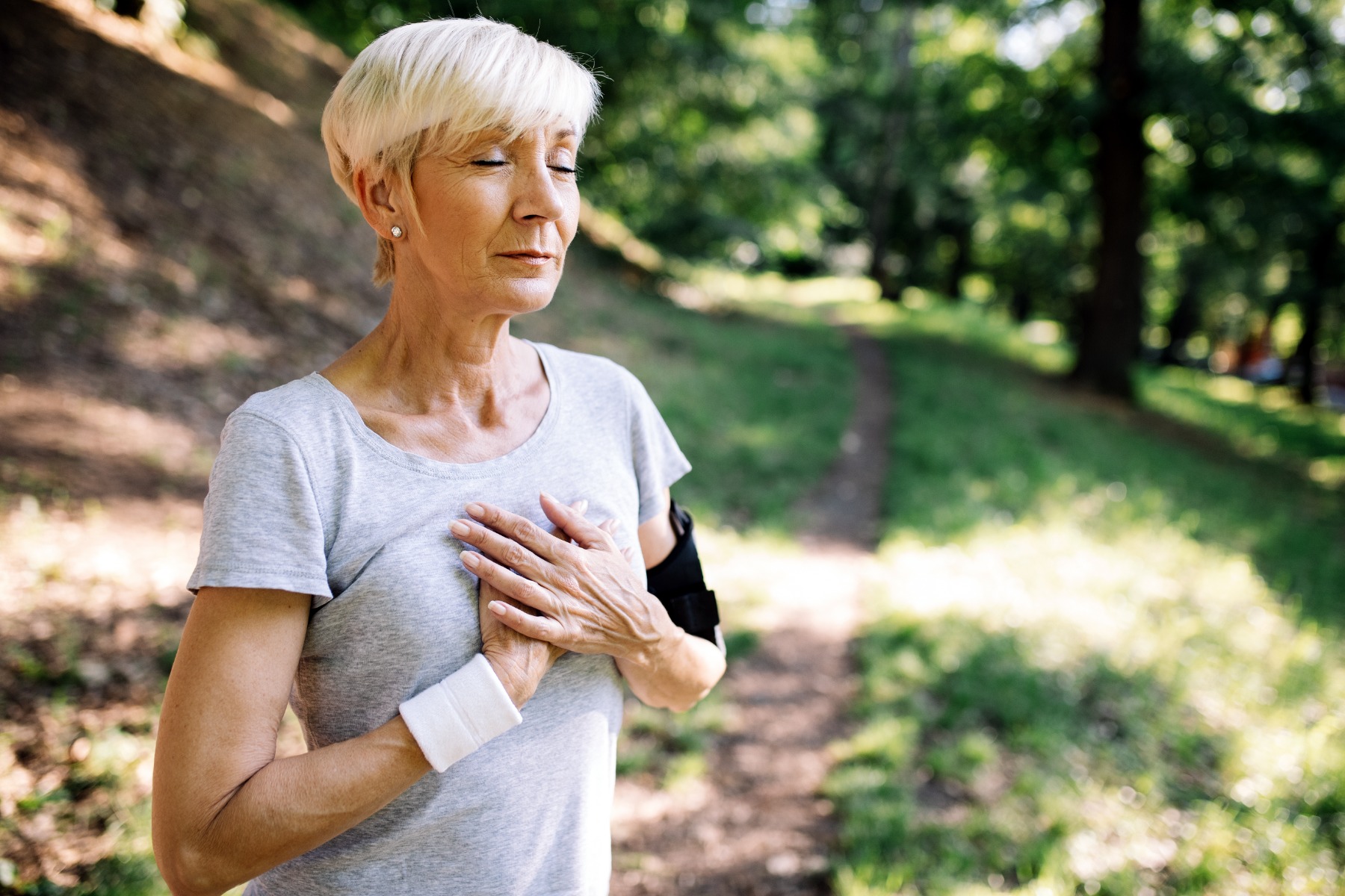 Lady holding her heart after excerise 